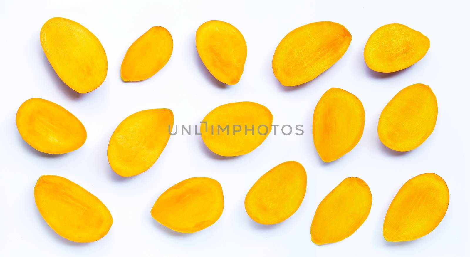 Tropical fruit, Mango slices on white background. Top view