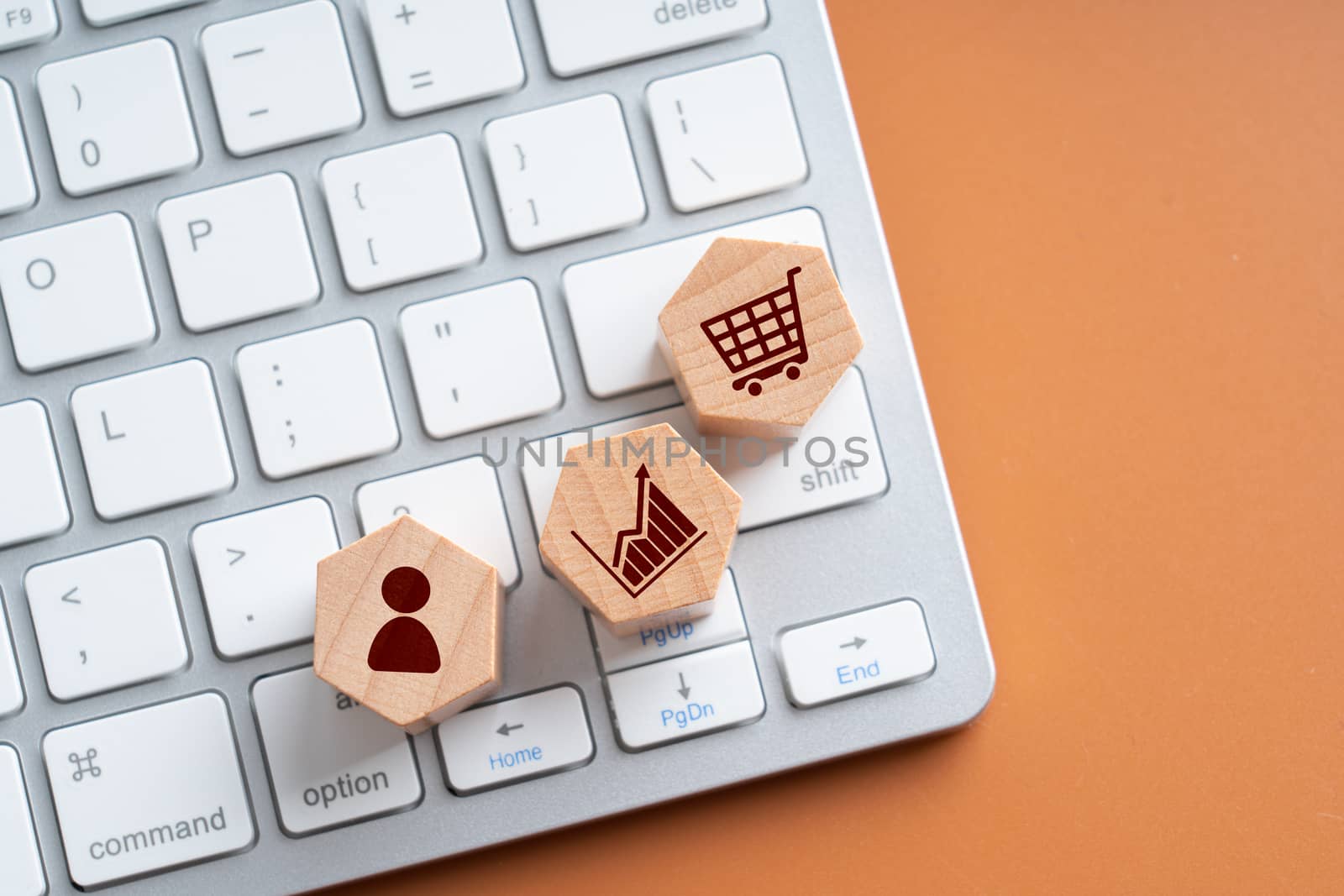 Online shopping icon on wood hexagon puzzle 

