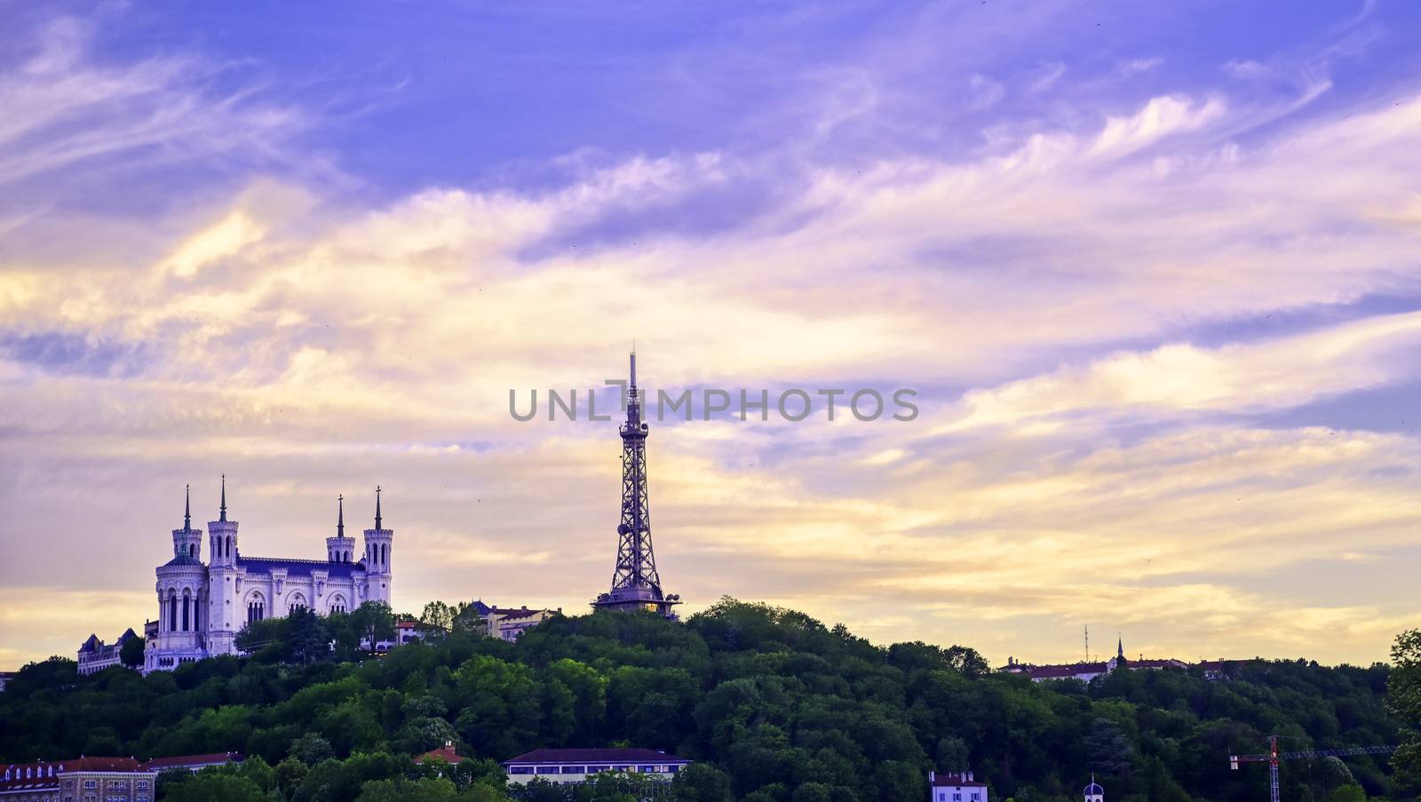 Lyon, France and the Basilica of Notre-Dame de Fourvière at sunset.