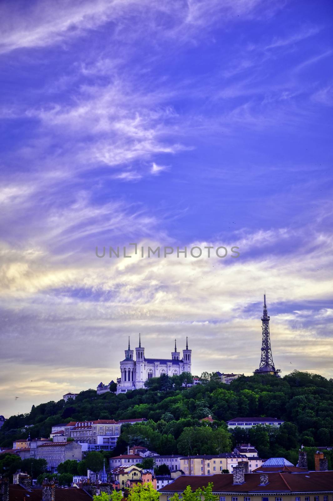 Lyon, France and the Basilica of Notre-Dame de Fourvière at sunset.