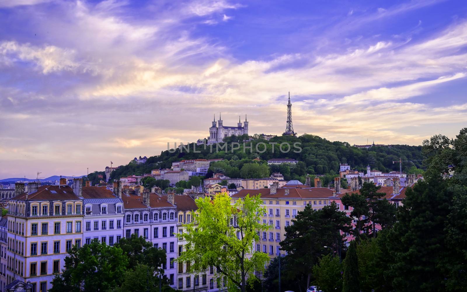 Lyon, France and the Basilica of Notre-Dame de Fourvière at sunset.