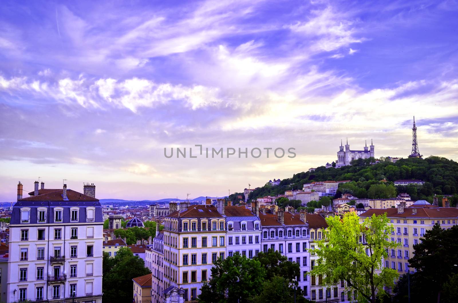 Lyon, France and the Basilica of Notre-Dame de Fourvière at sunset.