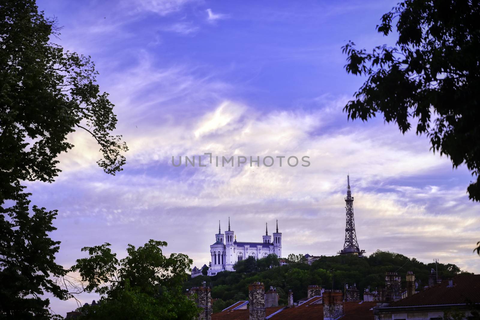 Lyon, France and the Basilica of Notre-Dame de Fourvière at sunset.