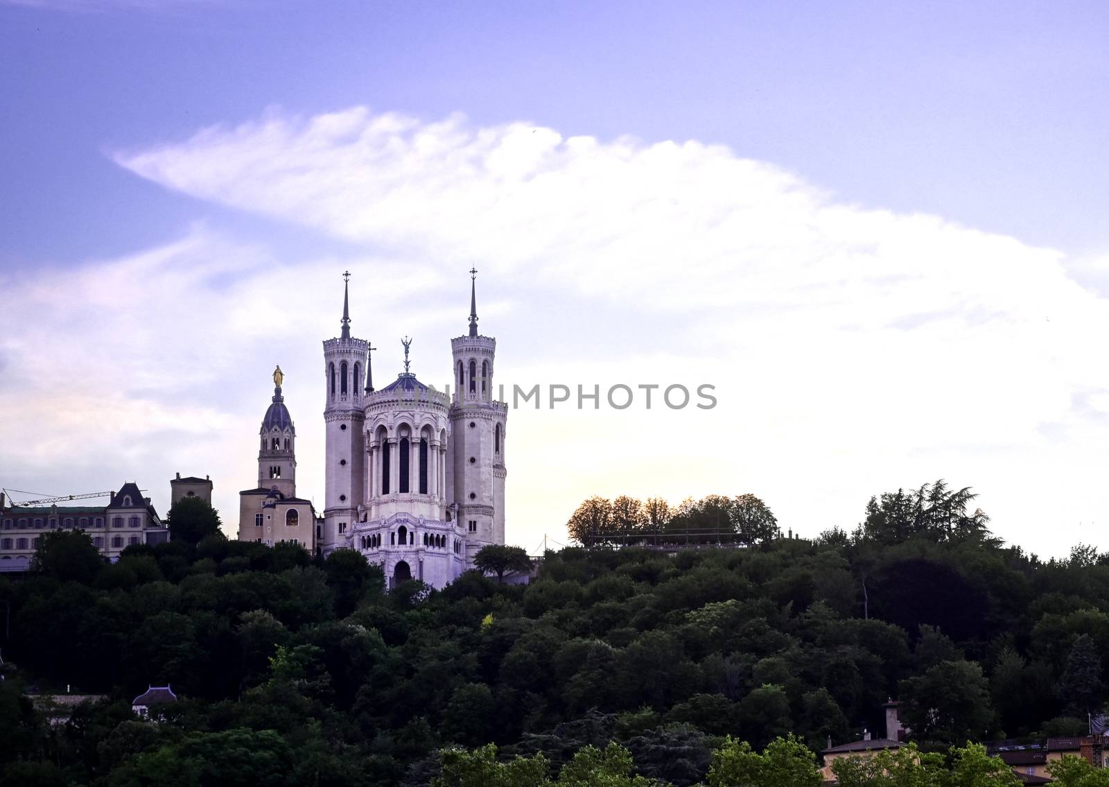 Lyon, France and the Basilica of Notre-Dame de Fourvière at sunset.