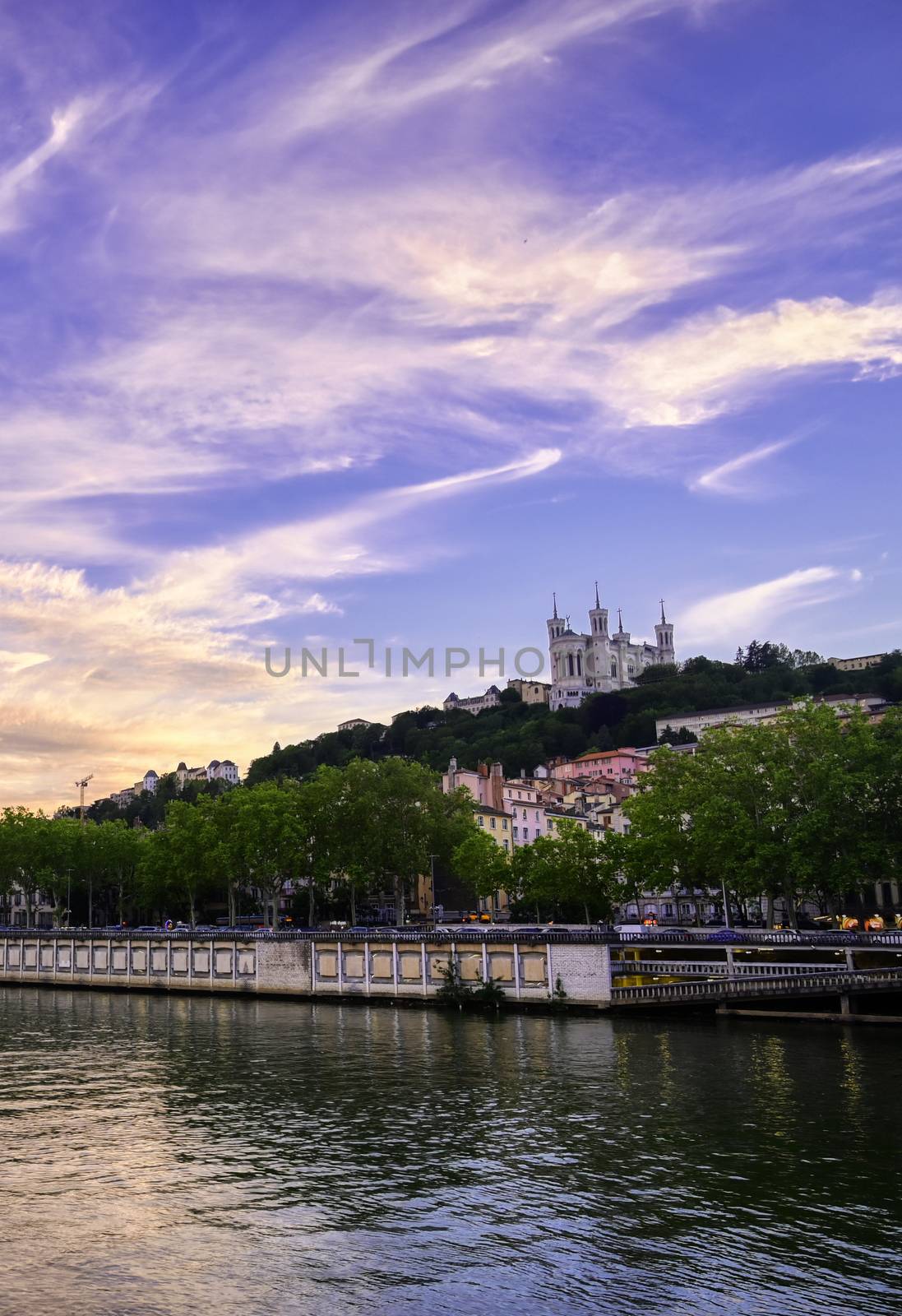 Lyon, France and the Basilica of Notre-Dame de Fourvière at sunset.