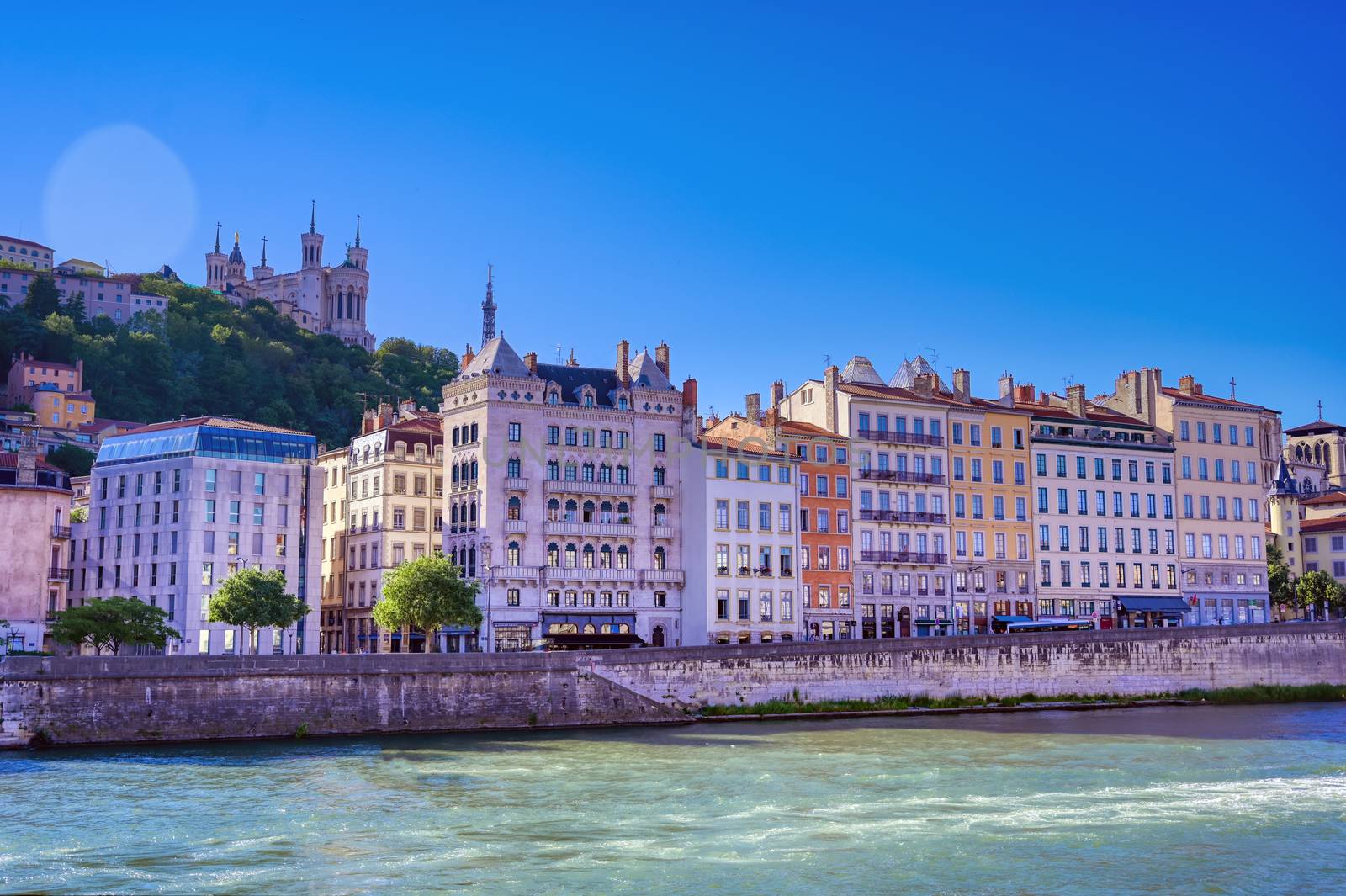 A view of Lyon, France along the Saone river in the afternoon.