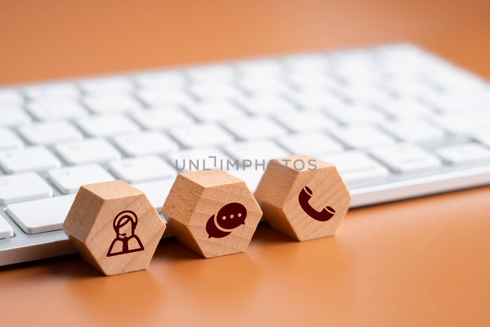 Contact us icon on wood puzzle 