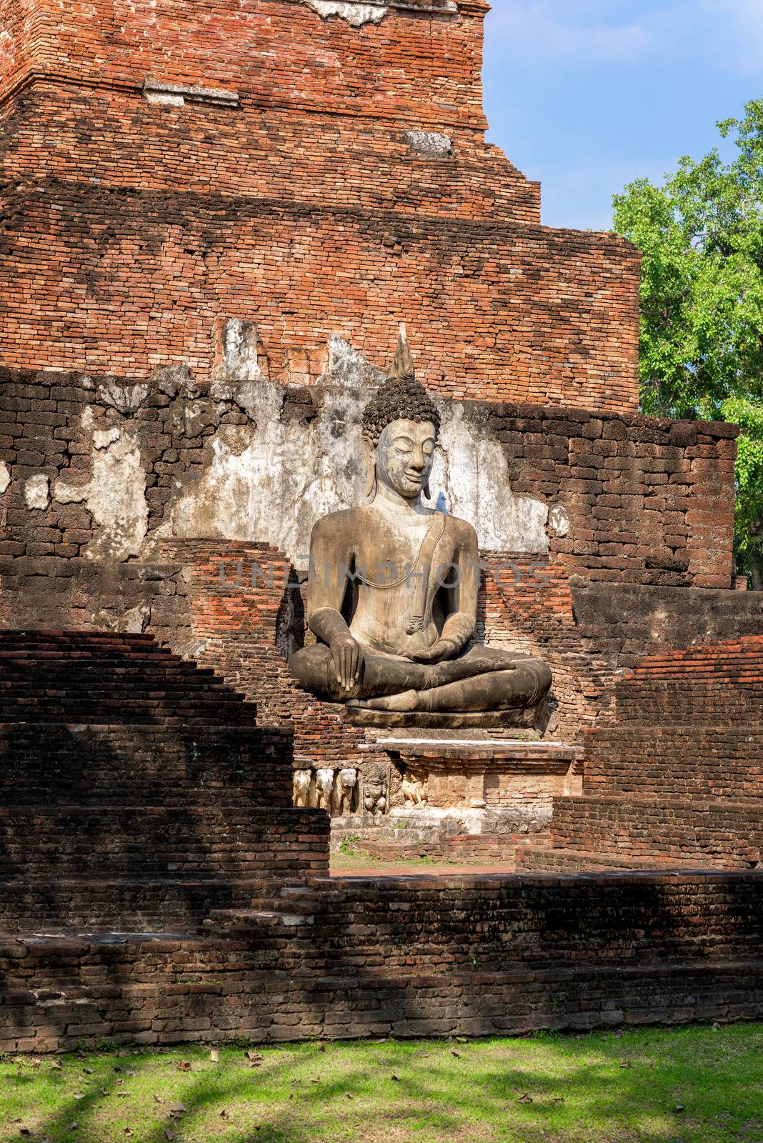 Ancient Buddha Statue at Wat Mahathat in Sukhothai historical park in Sukhothai, Thailand.