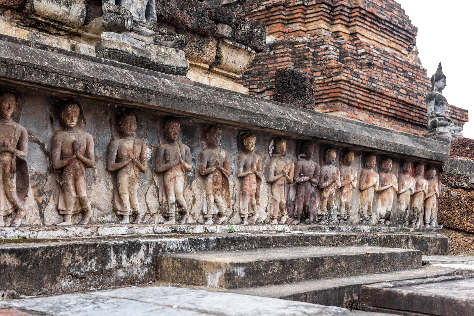 Ancient statues at Wat Mahathat in Sukhothai historical park in Sukhothai, Thailand.