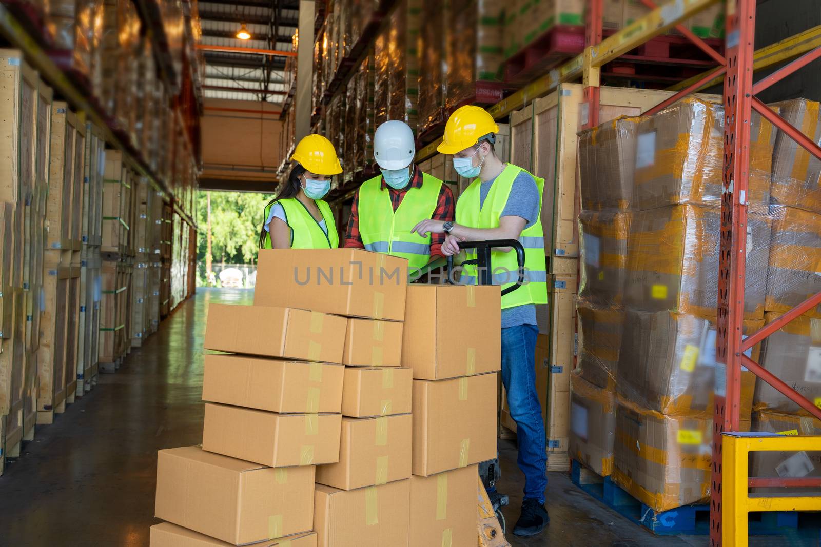Warehouse workers wearing protective mask to Protect Against Covid-19 by Visoot