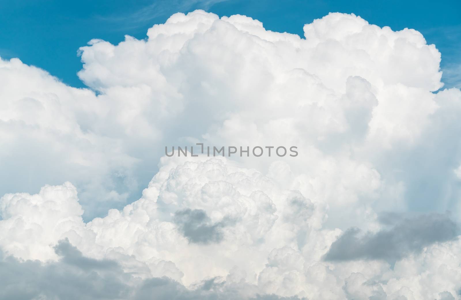 White fluffy clouds on blue sky. Soft touch feeling like cotton. by Fahroni