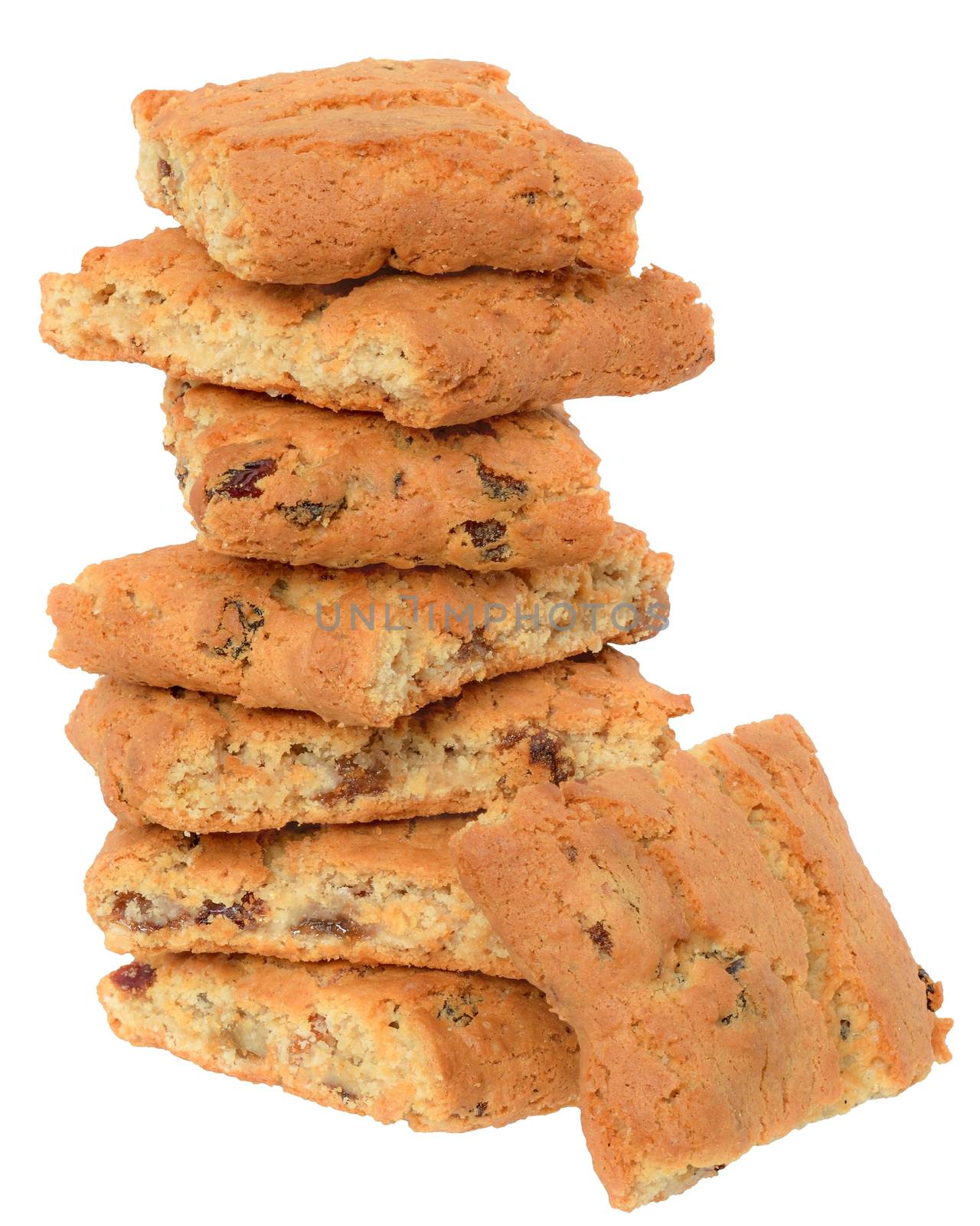 Appetizing chip cookies with raisins and candied fruit close-up tower isolated on white background. 