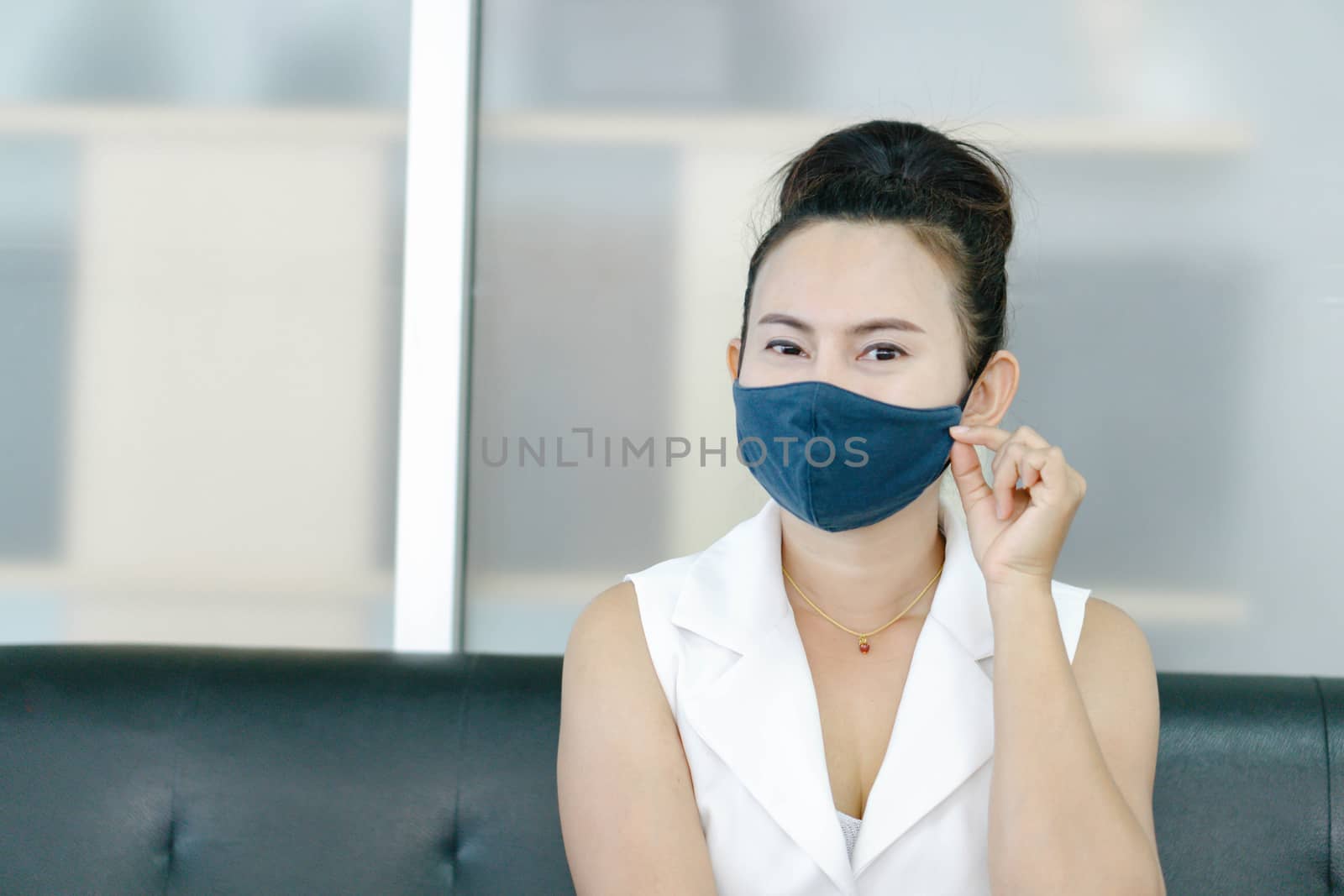 Closeup asian woman wearing face mask for protect air polution or virus covid 19, health care and medical concept