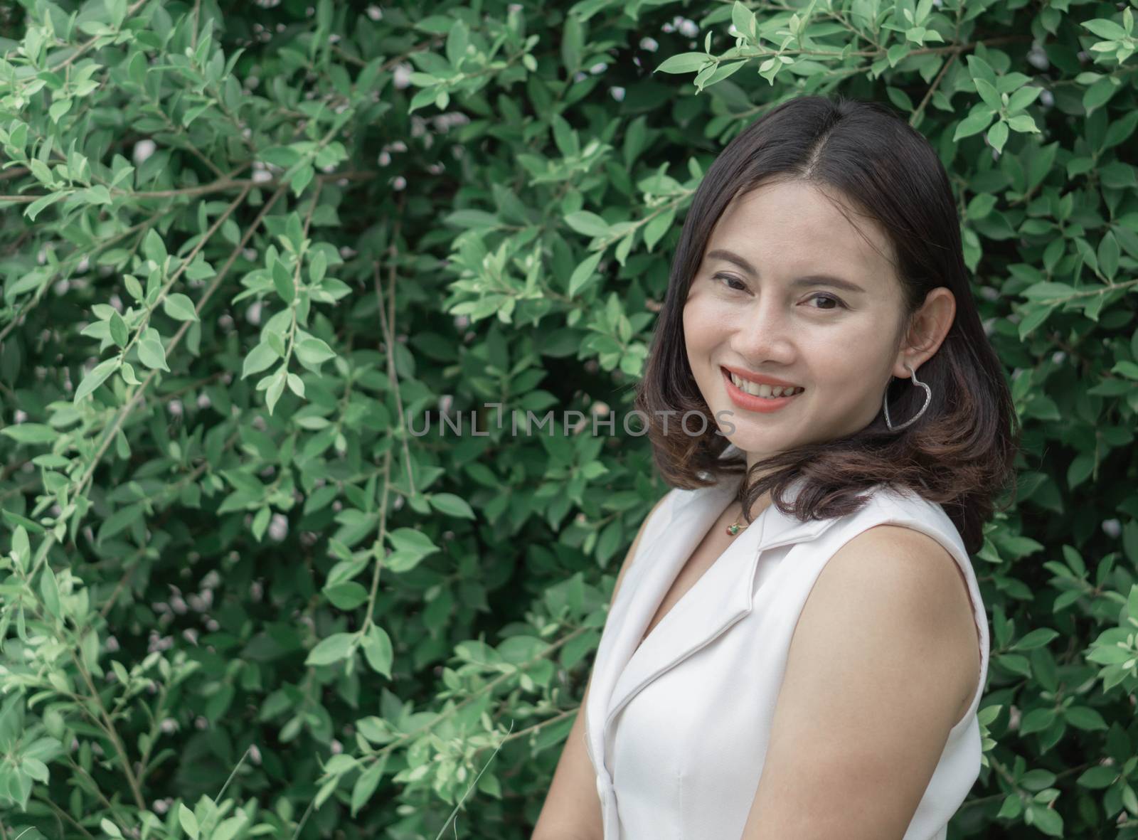 Woman happy feeling with green nature background