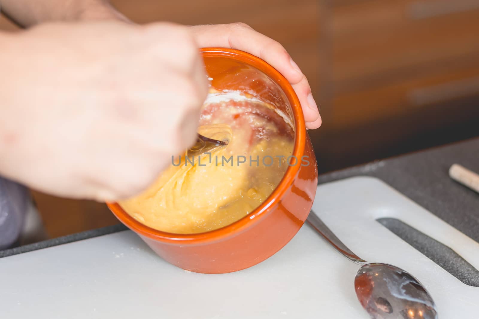 Cooking mixture of flour and eggs in a kitchen by AtlanticEUROSTOXX