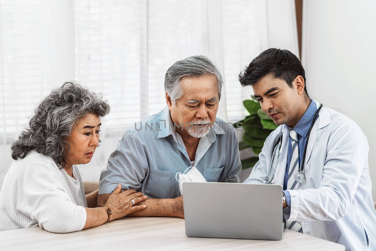 Doctor using technology laptop to explain and talking for auscul by Tzido