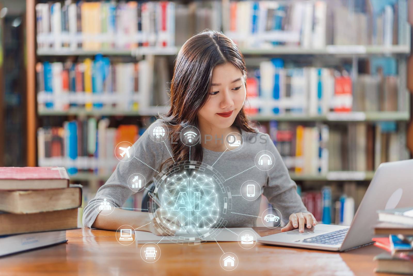 Polygonal brain shape of an artificial intelligence with various icon of smart city Internet of Things Technology over Asian young Student using technology laptop in library of university
