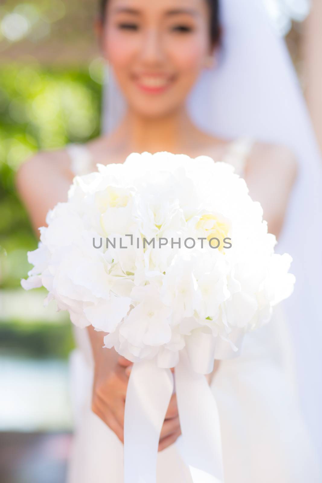 Beautiful wedding bouquet in hands of the bride