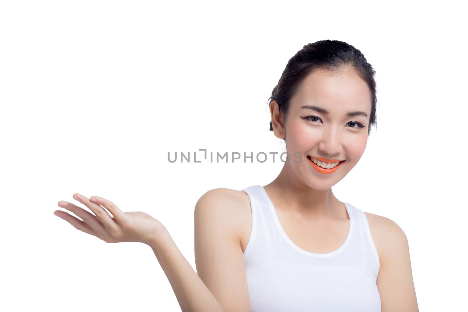 Beauty spa woman with perfect face skin Portrait. Beautiful Spa Girl showing empty copy space on the open hand palm for text. Proposing a product. Gesture for advertisement. Isolated on white background