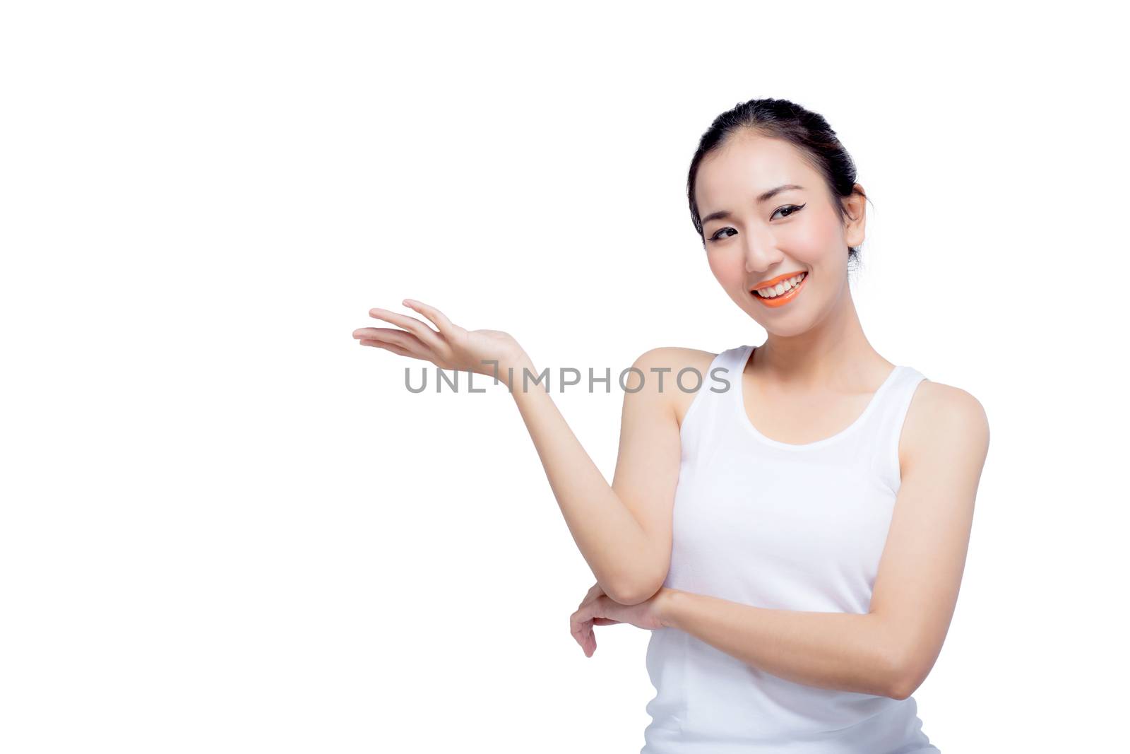 Beauty spa woman with perfect face skin Portrait. Beautiful Spa Girl showing empty copy space on the open hand palm for text. Proposing a product. Gesture for advertisement. Isolated on white background