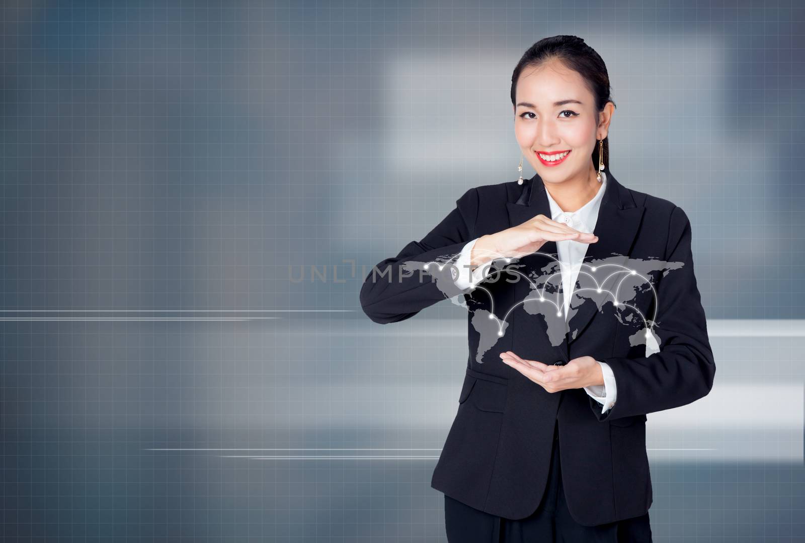 Young Asian businesswoman holding a globe with social network. E by nnudoo