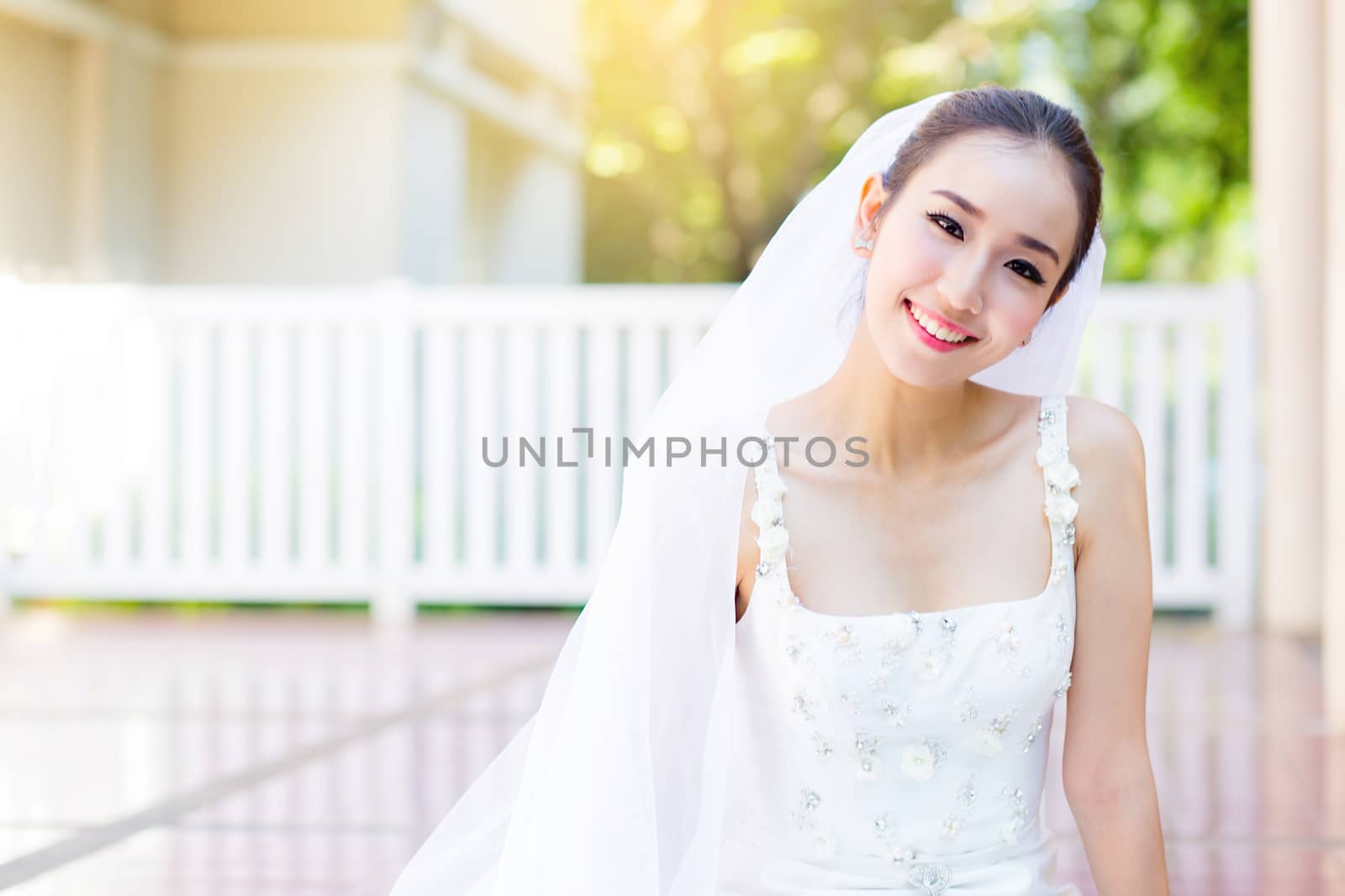 bride is sitting with flowers. Beautiful Young woman posing in p by nnudoo