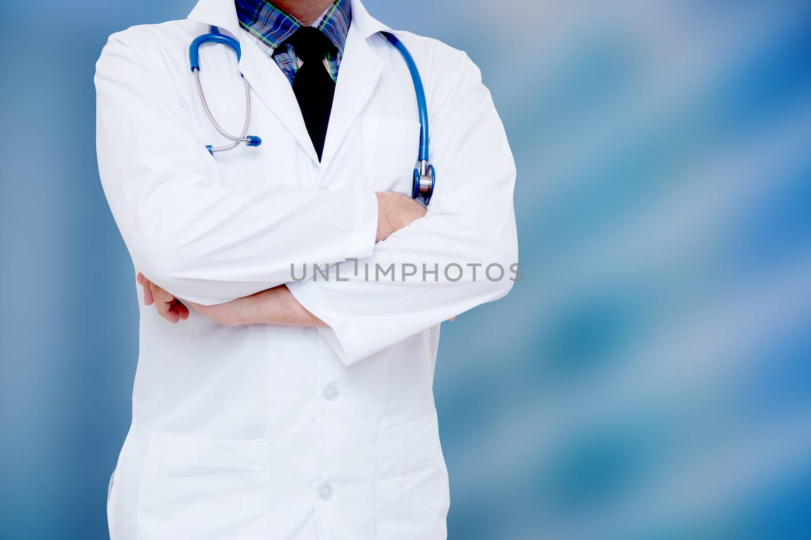 portrait of male doctor on blue background