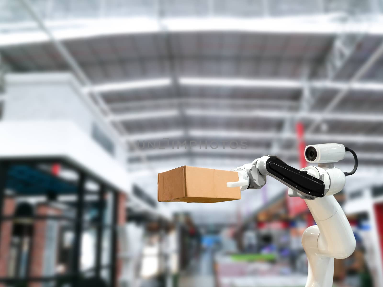 Industrial technology using robots mechanical arm the box in the factory by sompongtom