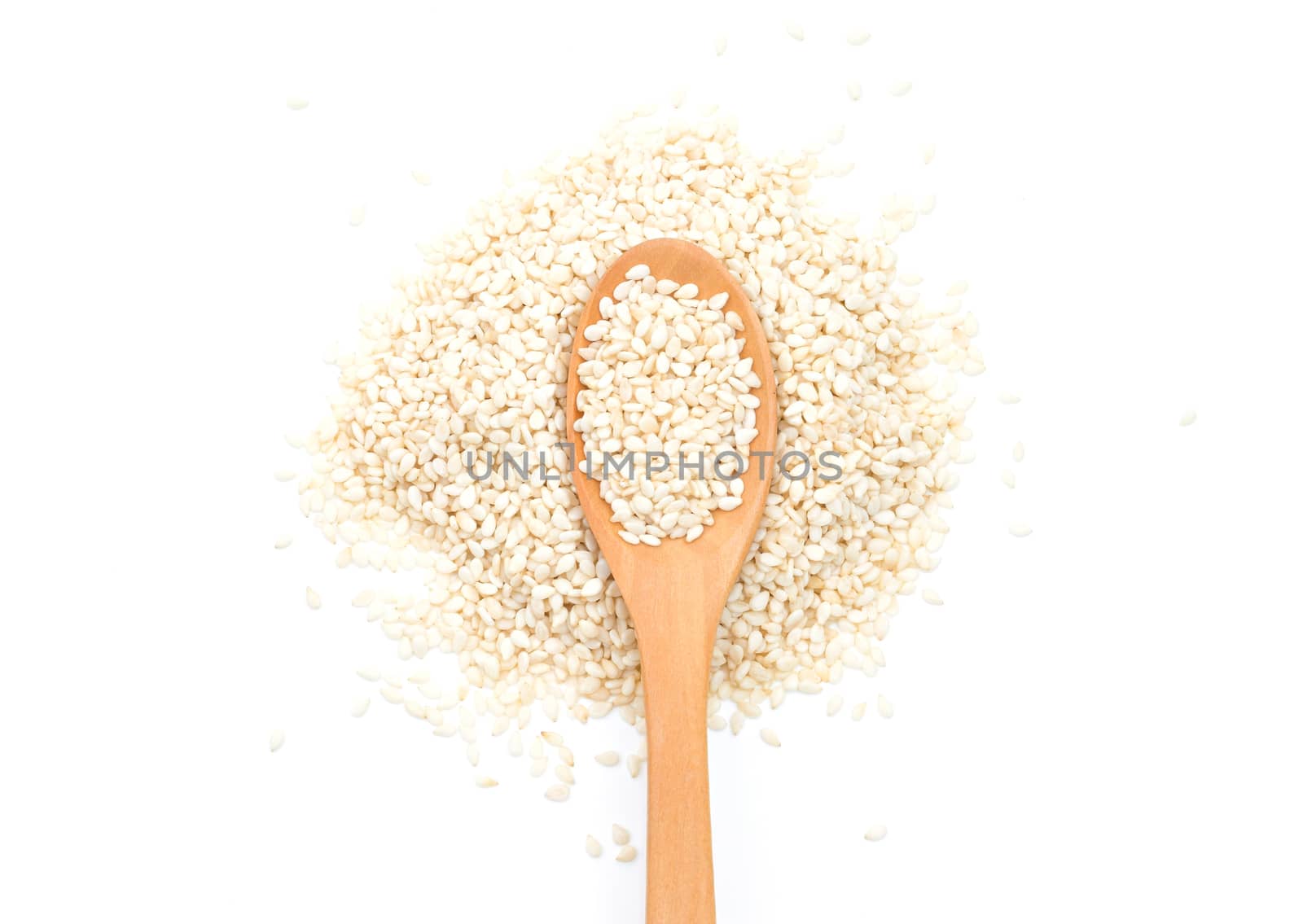 White sesame seeds in wooden scoop on white background by sompongtom