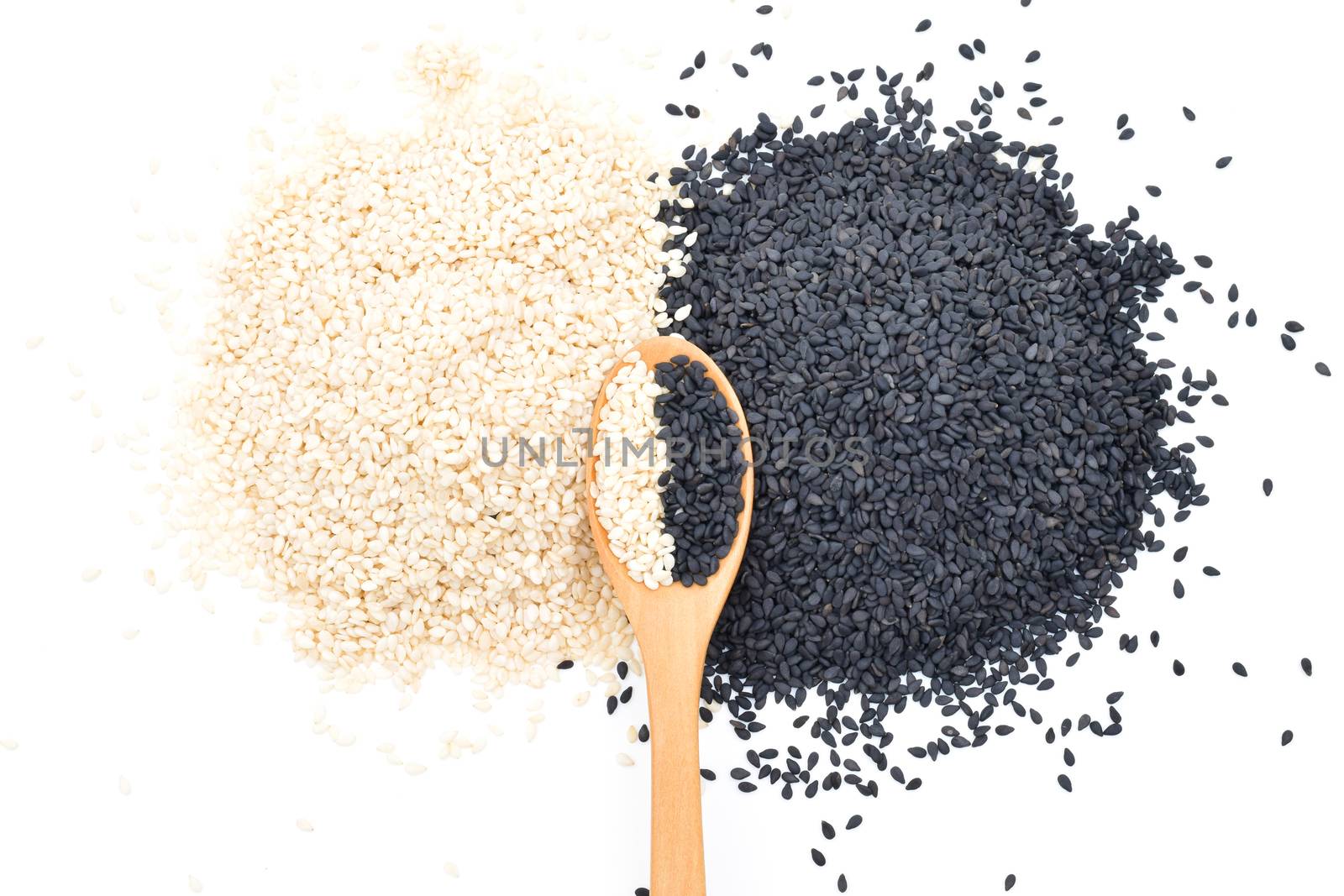 White and Black sesame seeds in wooden scoop on white background