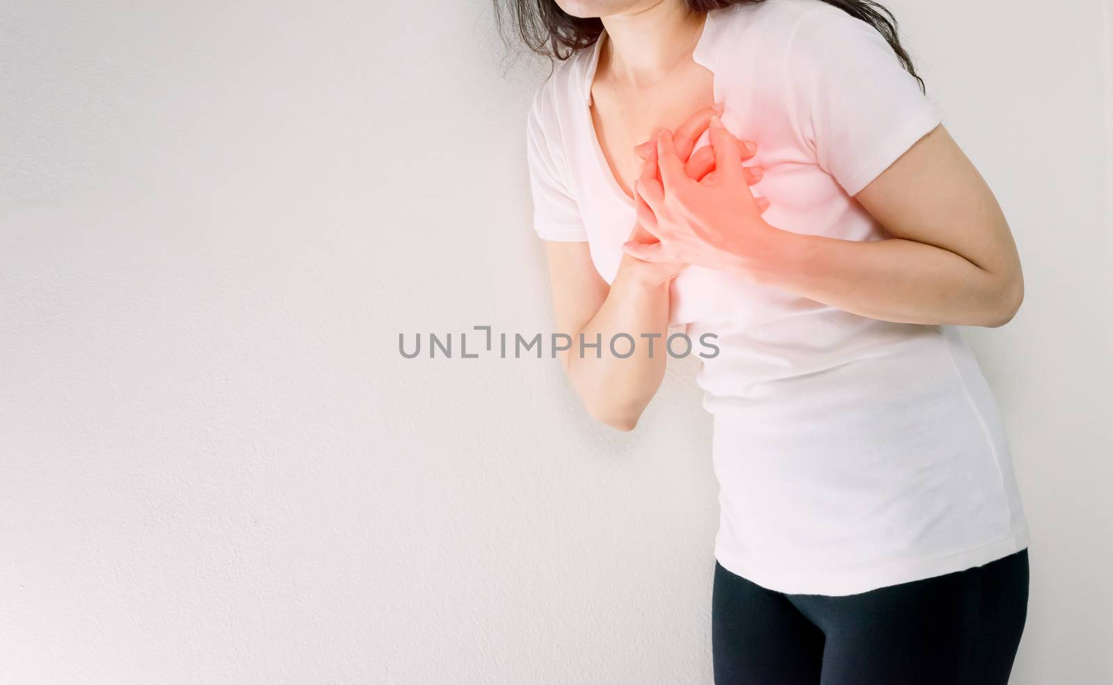 Woman holding hands in the chest With a heart attack by sompongtom