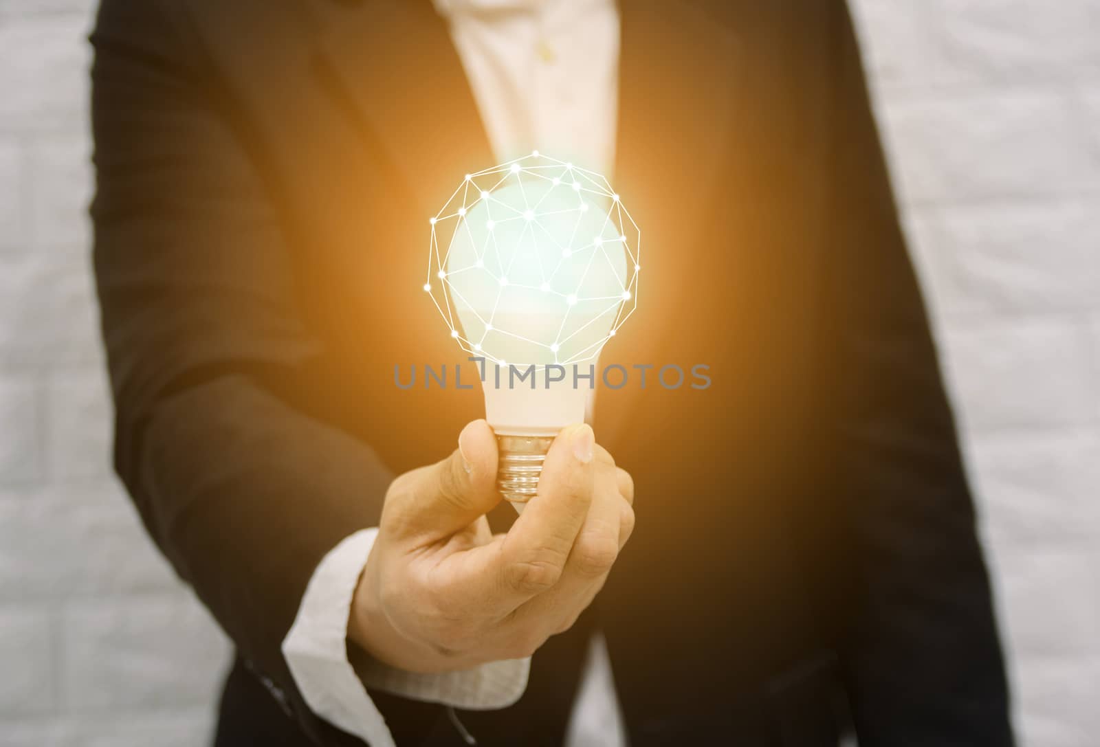 Light bulb new ideas with innovative technology solution concepts hands of the businessman. by sompongtom