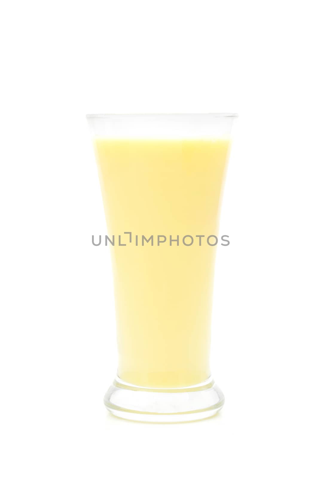 Corn milk in a glass on a white background