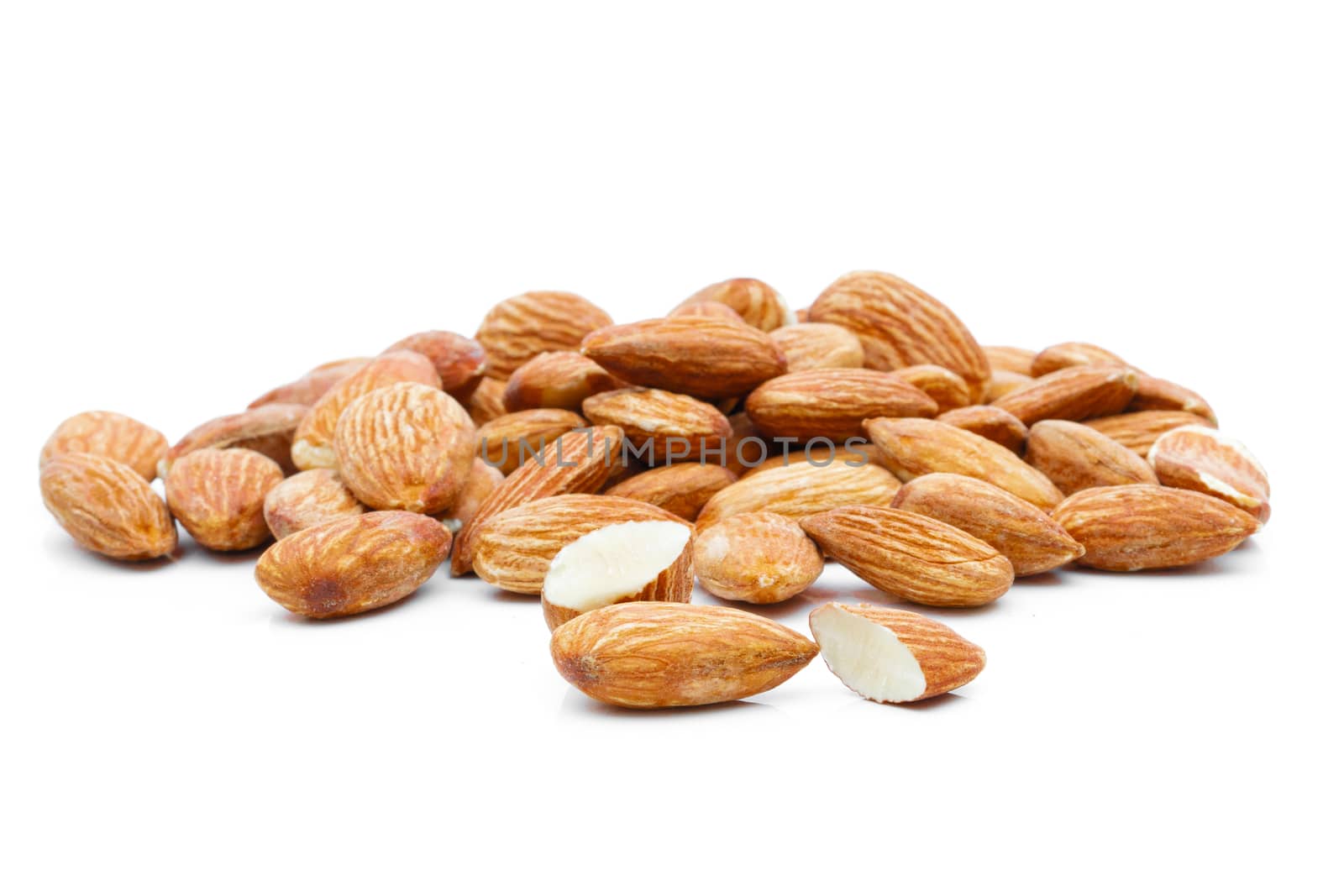 Almonds in a sack of cloth on a white background by sompongtom