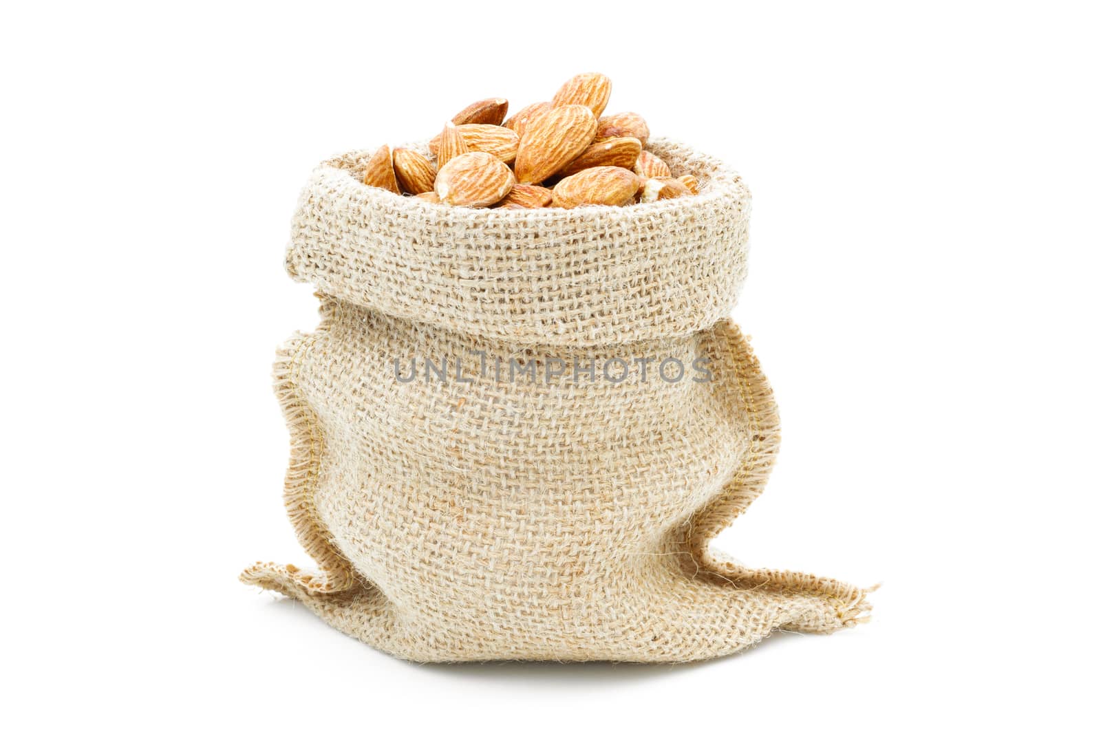 Almonds in a sack of cloth on a white background