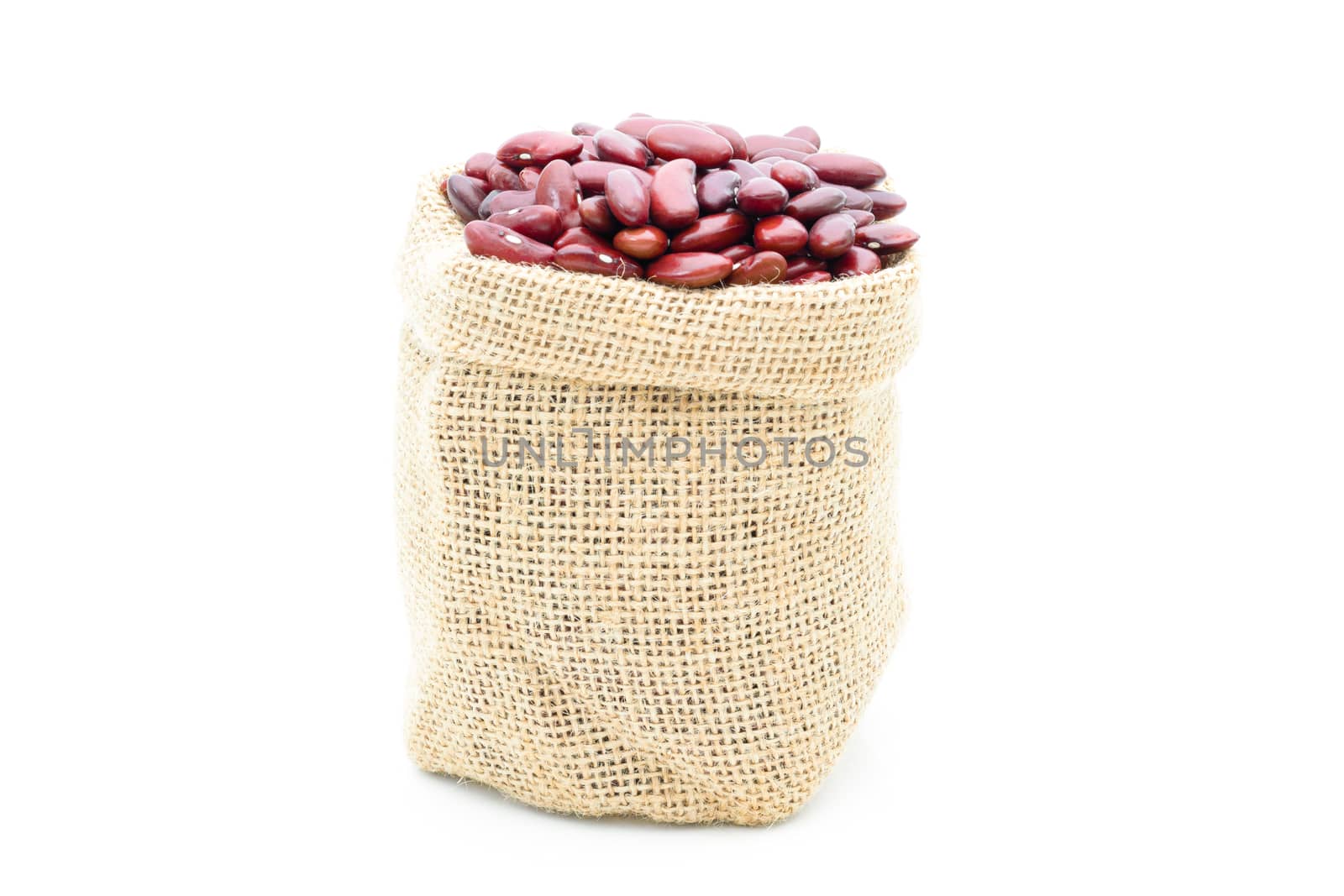 Grains Red beans in a sack on a white background by sompongtom
