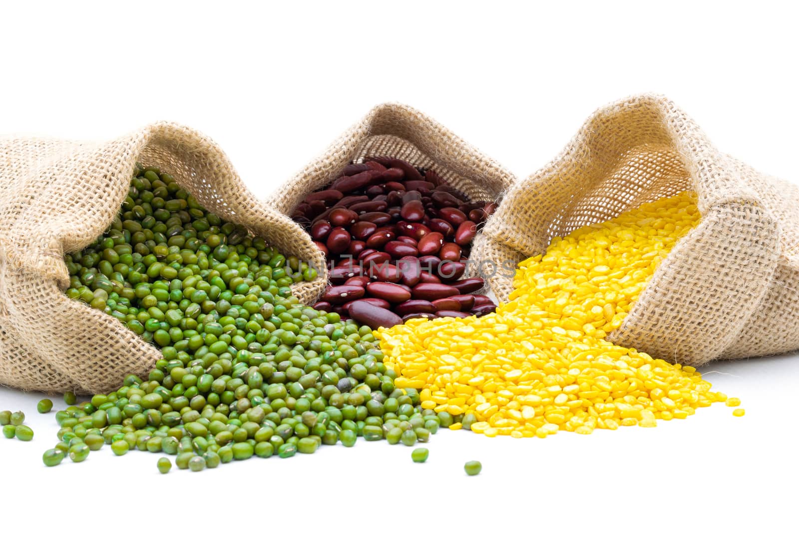 Grains Mung bean and red beans in a sack on a white background by sompongtom