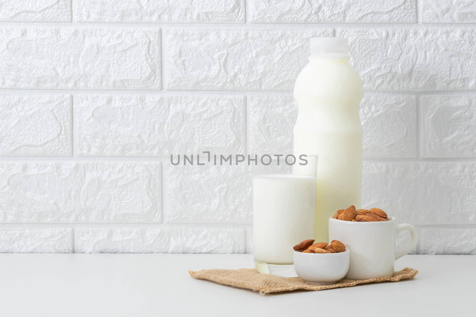 Milk Almonds in a glass on a white background by sompongtom