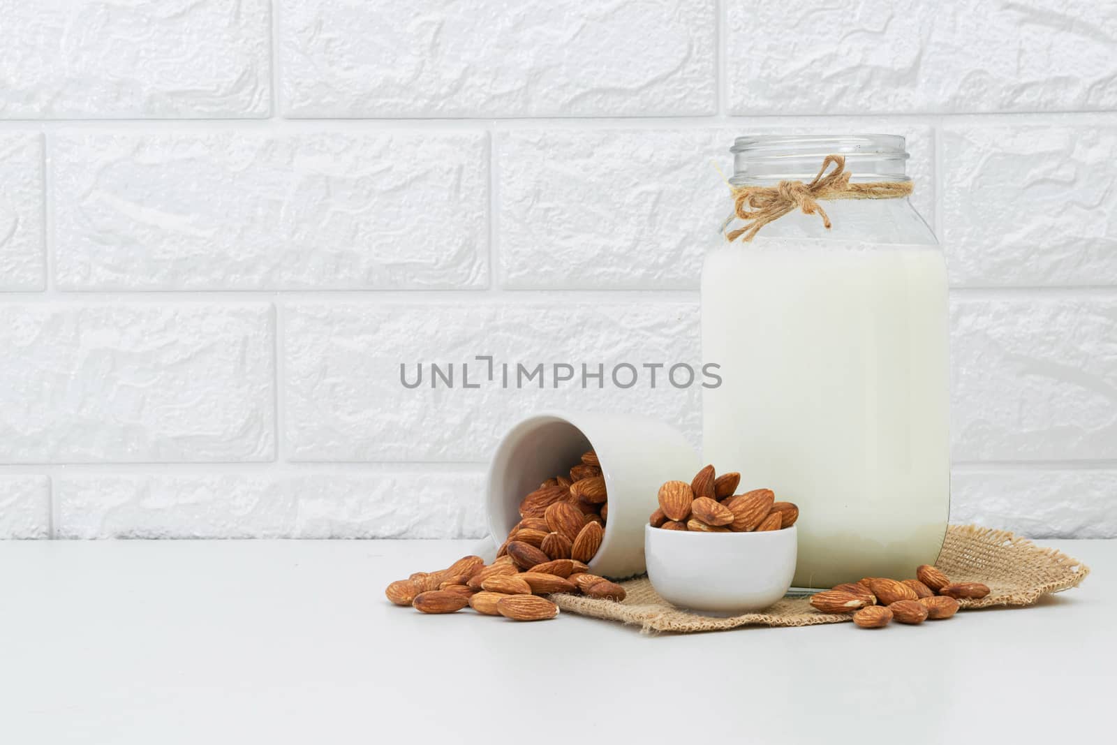 Milk Almonds in a glass on a white background