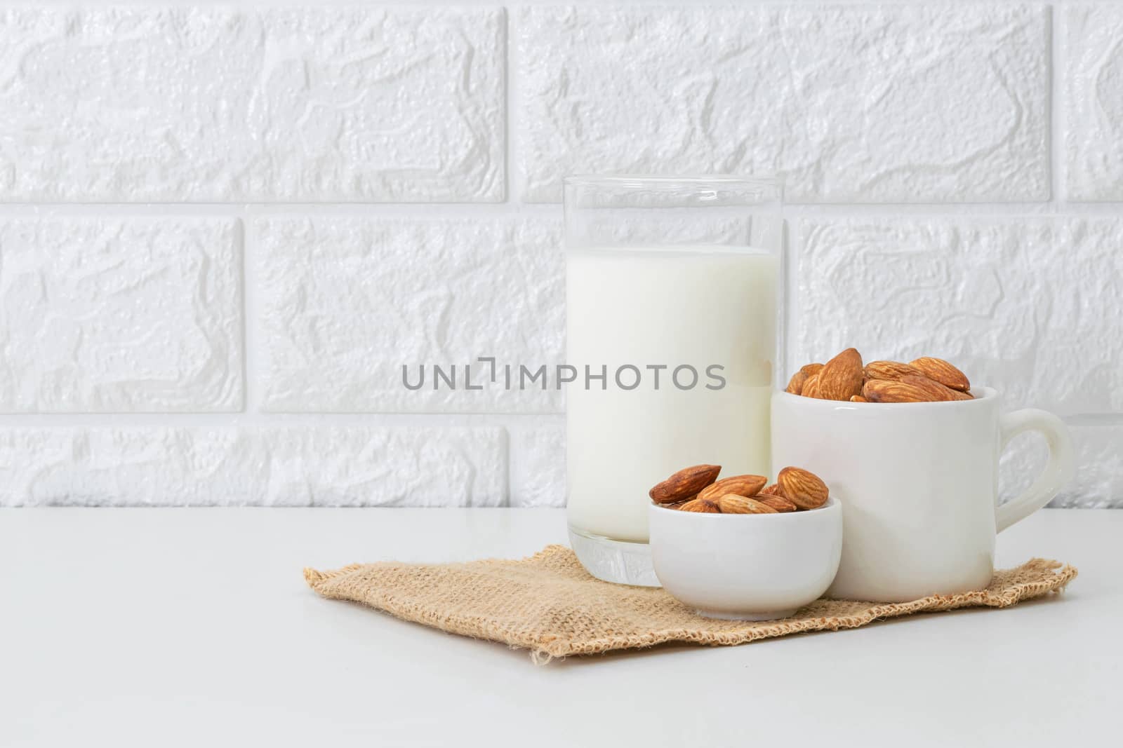 Milk Almonds in a glass on a white background by sompongtom