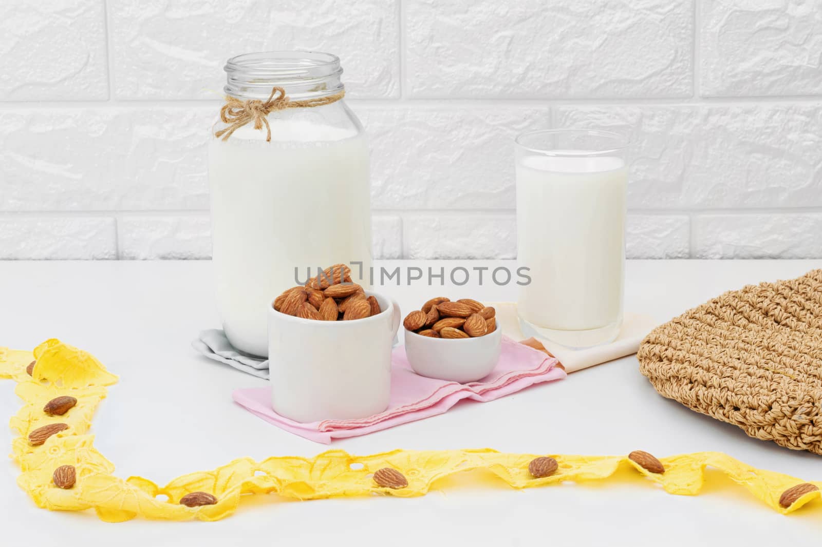 Milk Almonds in a glass on a white background by sompongtom