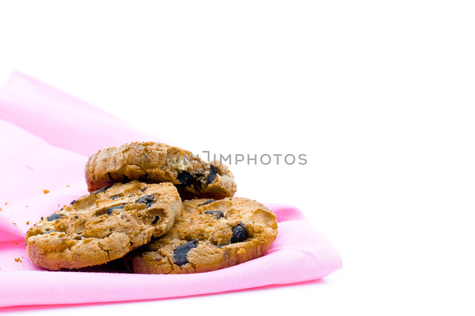 Chocolate cookies on a pink fabric white background