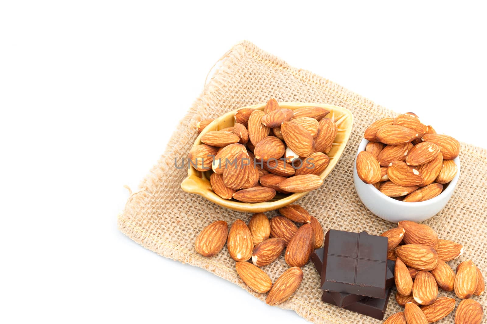 Chocolate and Almonds on a white background