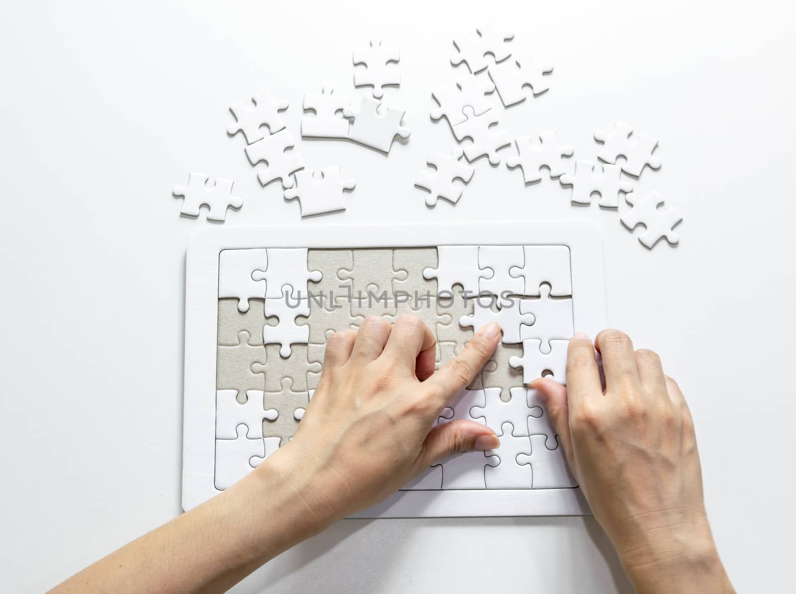 Fill the missing parts fragment of white jigsaw concept puzzle for succeed by sompongtom