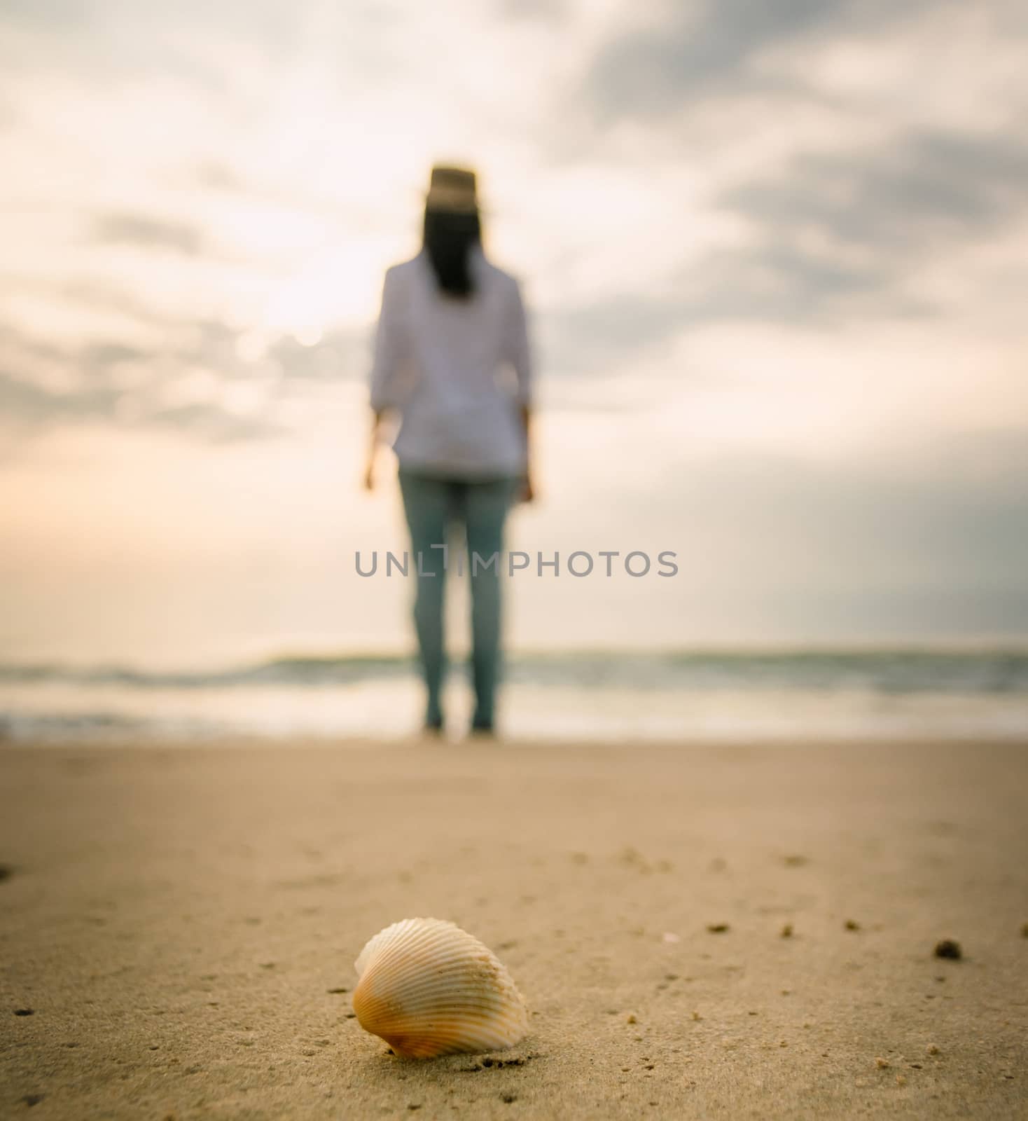 Shells on the beach female happy travel holiday
