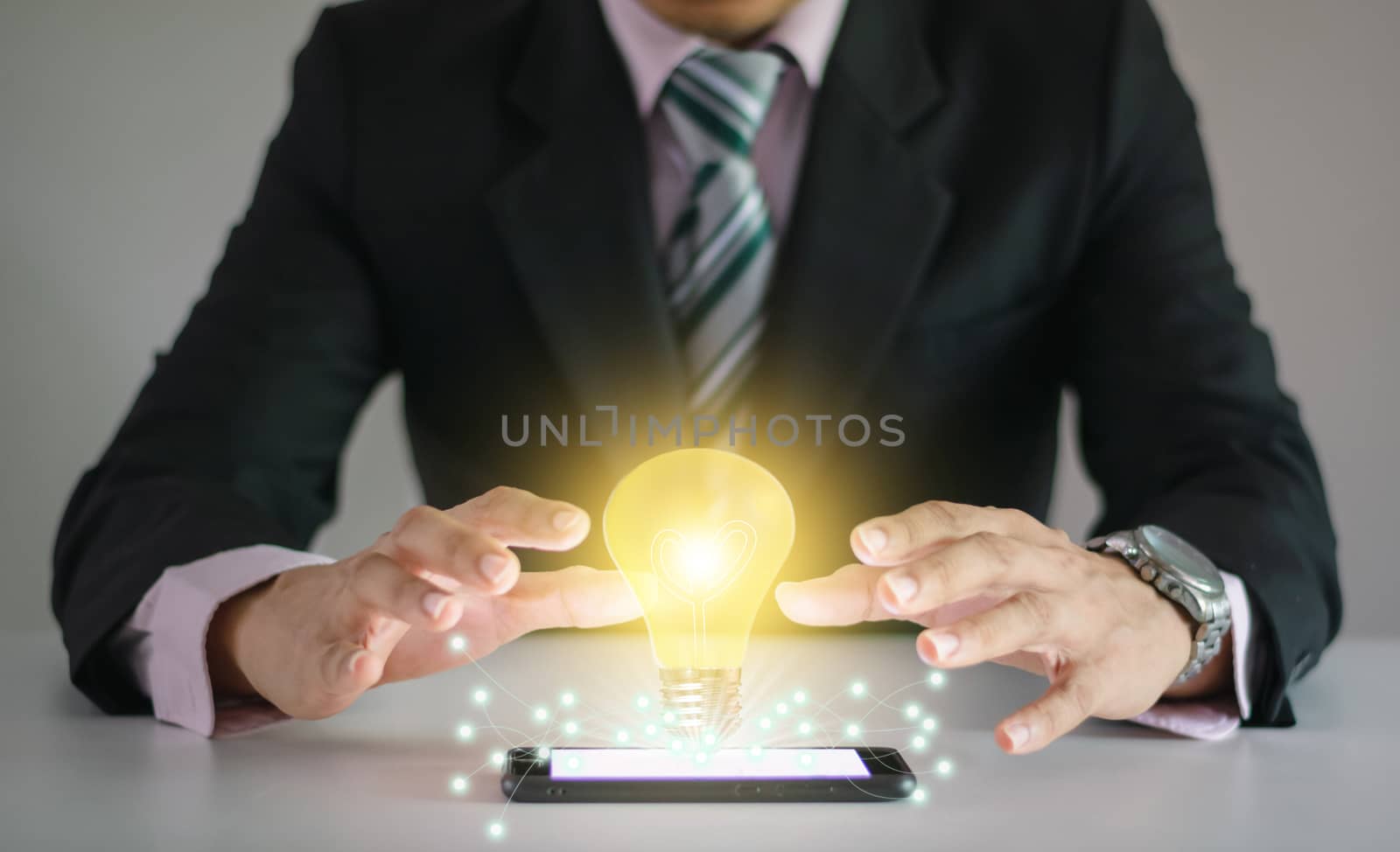 Light bulb new ideas with innovative technology solution concepts hands of the businessman.
