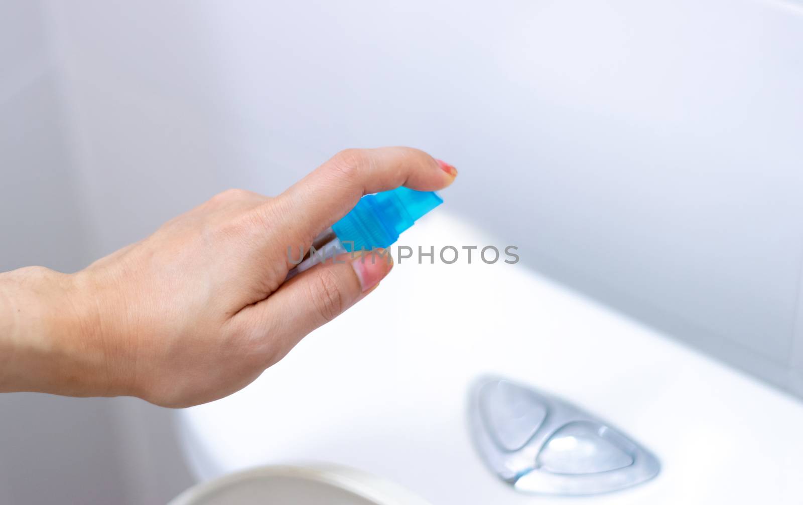 Alcohol spray press flush toilet clean protection against Coronavirus 2019 (Covid-19) by sompongtom