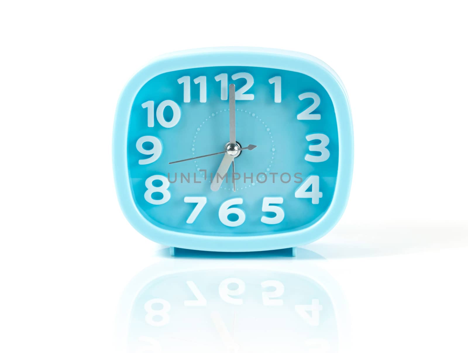 Blue table clock on a white background by sompongtom