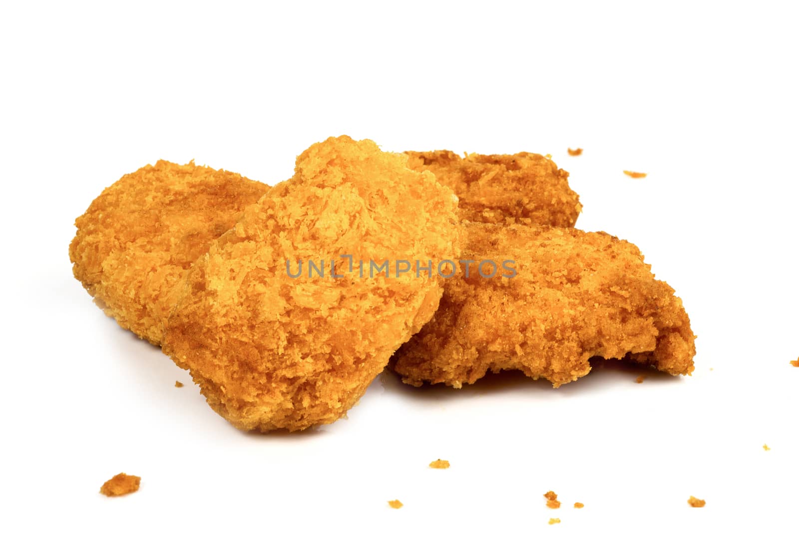 Fried Chicken Nuggets on a white background by sompongtom