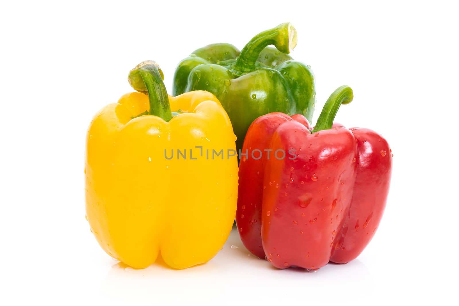 Large bell pepper red, green and yellow on a white background by sompongtom